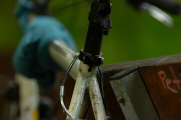 This closeup highlights the bicycles handlebar mechanism and frame connection, showcasing...