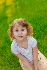 Portrait of a child on the grass. Selective focus.