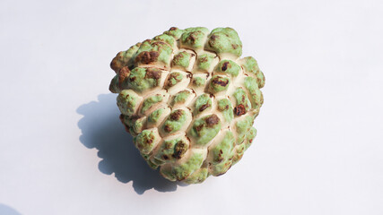 Green fruit food Srikaya, Cherimoya Sugar Apple or Custard Apple or cinnamon apple or Annona squamosa, white bokeh background. for copy space.