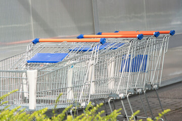 Supermarket shopping carts,Lots of empty shopping carts. Rows of shopping carts next to a...