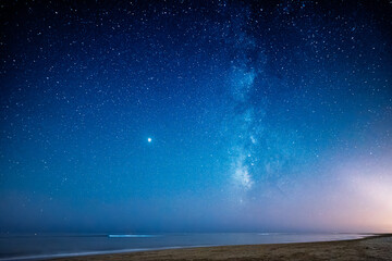 Fototapeta premium Milky Way shining over Punta del Moral beach at night