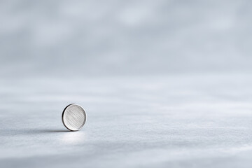minimalistic photograph of shiny coin for slot machine on ultrabright clean background