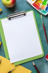 Blank clipboard on a colorful art supplies background