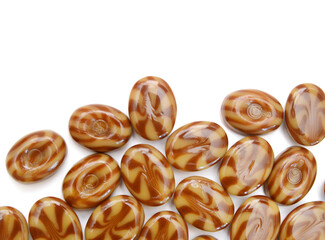 Caramel candies isolated on white background