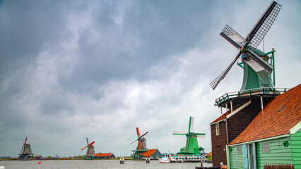 old dutch village with canals and windmills