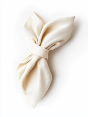Elegant folded cream napkin on a white background