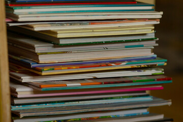 A wellorganized collection of diverse magazines, neatly stacked and showcasing vibrant colors and innovative designs that captivate and spark interest with their unique content