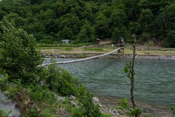 Thin suspension bridge over the Chorukh River, Georgia