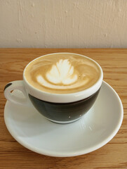 cup of coffee on wooden table