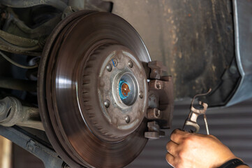 mechanic changing the wheel of a car