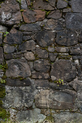 The stone wall of the old fortress of Gvara. The background is a stone wall