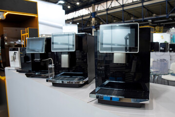 Modern automatic coffee machines in a row