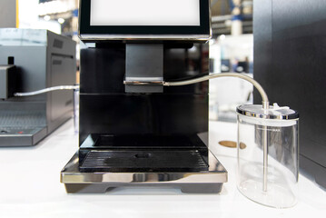 Automatic coffee machine with milk container and touchscreen