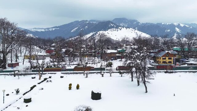Drone footage showing the peaceful life of a Himalayan village during gentle snowfall in Verinag.