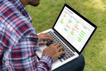 Project planning software for modish business project management on the computer screen showing timeline chart of the team project