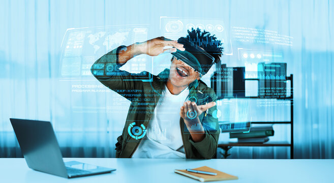 Businessman looking at financial statistic while wearing VR glasses. Manager checking and analyzing business data and financial chart while making decision by using artificial intelligence. Ingenuity. - Powered by Adobe