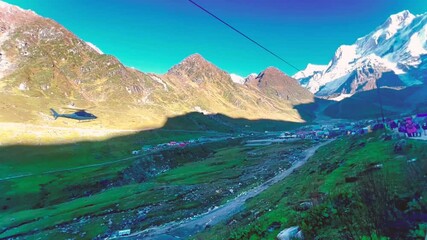 helicopter flying over kedarnath himalayas in uttarakhand india offering aerial view of majestic mountains and sacred temple in high altitude
