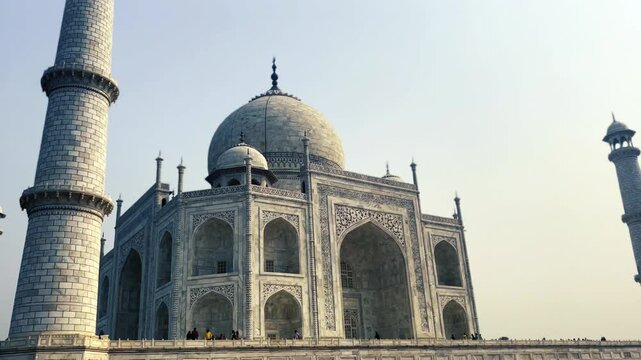 closeup view of iconic taj mahal mausoleum with dome and minaret in agra india showcasing world famous white marble architecture and mughal era artistic wonder