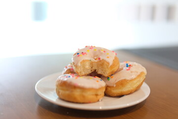 Delicious assorted colorful donuts on the table. High quality photo
