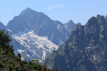 mountain peaks of the North Caucasus in Dombay on a sunny summer day