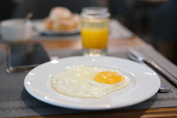 Fried eggs with cherry tomatoes on a plate. High quality photo