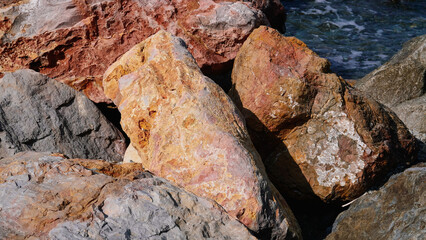Rocks of the Mediterranean Sea in the port of the French city of Banyuls-sur-Mer, vacation in Europe, summer
