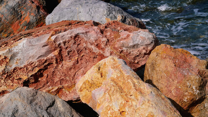 Rocks of the Mediterranean Sea in the port of the French city of Banyuls-sur-Mer, vacation in Europe, summer