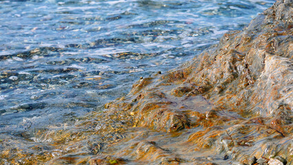 Rocks of the Mediterranean Sea in the port of the French city of Banyuls-sur-Mer, vacation in Europe, summer