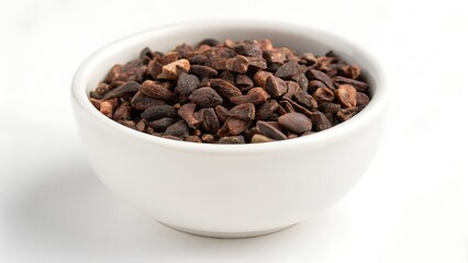 Fototapeta premium Bowl Containing Whole Cacao Nibs On Clean White Background
