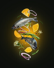 Sea trout with rosemary branches and lemon slices in the air in the dark