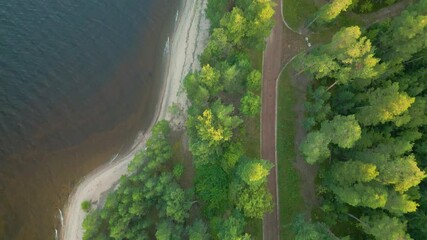 road along the lake shore - drone view from above. - Powered by Adobe