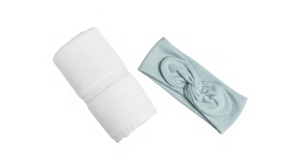 Elegant white towel and a stylish light blue knotted headband present a soft and peaceful ambiance.