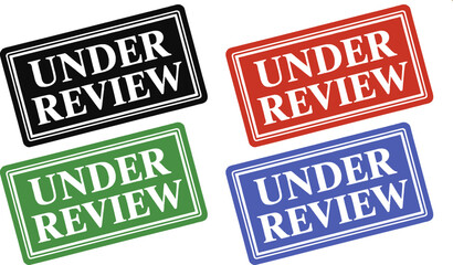 A close up of a white paper with the words under review in red letters