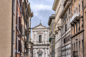 Via del Banco di Santo Spirito with church at the end in Rome, Italy