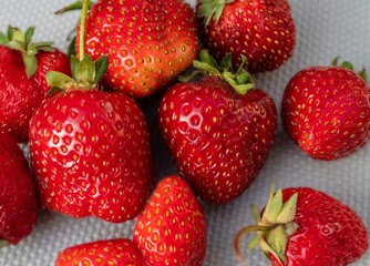 Close-up of ripe juicy strawberries with natural defects