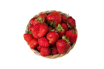 Fresh organic strawberries with natural blemishes in a wicker basket