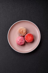 Chinese mooncake is an Asian sweet dessert. Asian mooncake as a background for your design