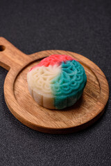 Chinese mooncake is an Asian sweet dessert. Asian mooncake as a background for your design