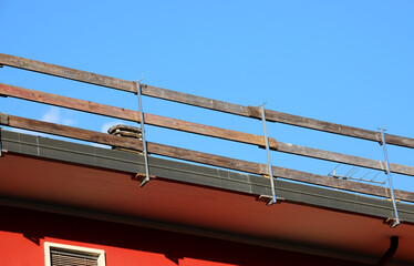 installed safety barrier for workers safety to prevent falls during maintenance work on the roof of...