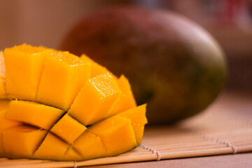 Juicy Cubed Mango on a Natural Textured Wooden Surface