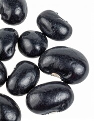 Black Beans on Isolated White Background – Dark Legumes with Glossy Surface and Natural Macro Focus