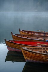 Rowing boats in the fog, Dolomites, Italy
