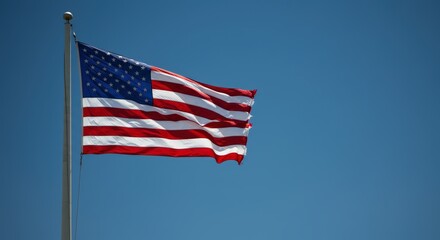 American Flag Waving Proudly Under a Clear Blue Sky