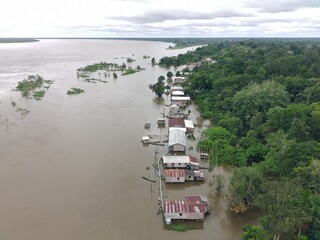 houses in an area flooded by the great flood of 2025 in the Amazon