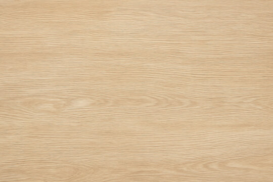 Light wood texture with natural wood grain patterns, perfect for backgrounds. A close-up view of a light brown wood grain texture. The natural patterns and details of the wood are visible