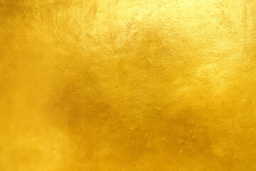 A golden, textured background with a subtle, artistic finish, perfect for adding a touch of luxury or elegance to any design.