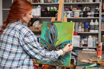 A Creative Artist Skillfully Painting a Beautiful and Colorful Abstract Flower Artwork