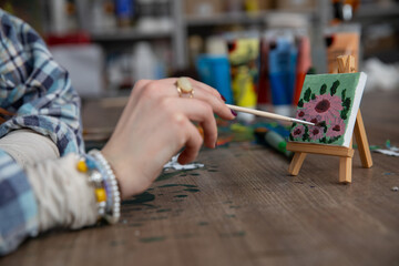Creative Hands Engaged in a Fun and Enjoyable Painting Activity that Sparks Imagination