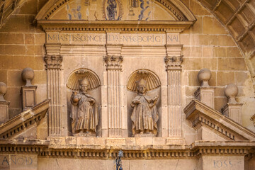 stone carvings located on the front of a church