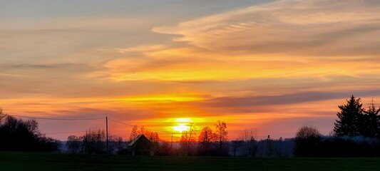 A breathtaking and stunningly beautiful sunset over a tranquil and peaceful landscape setting